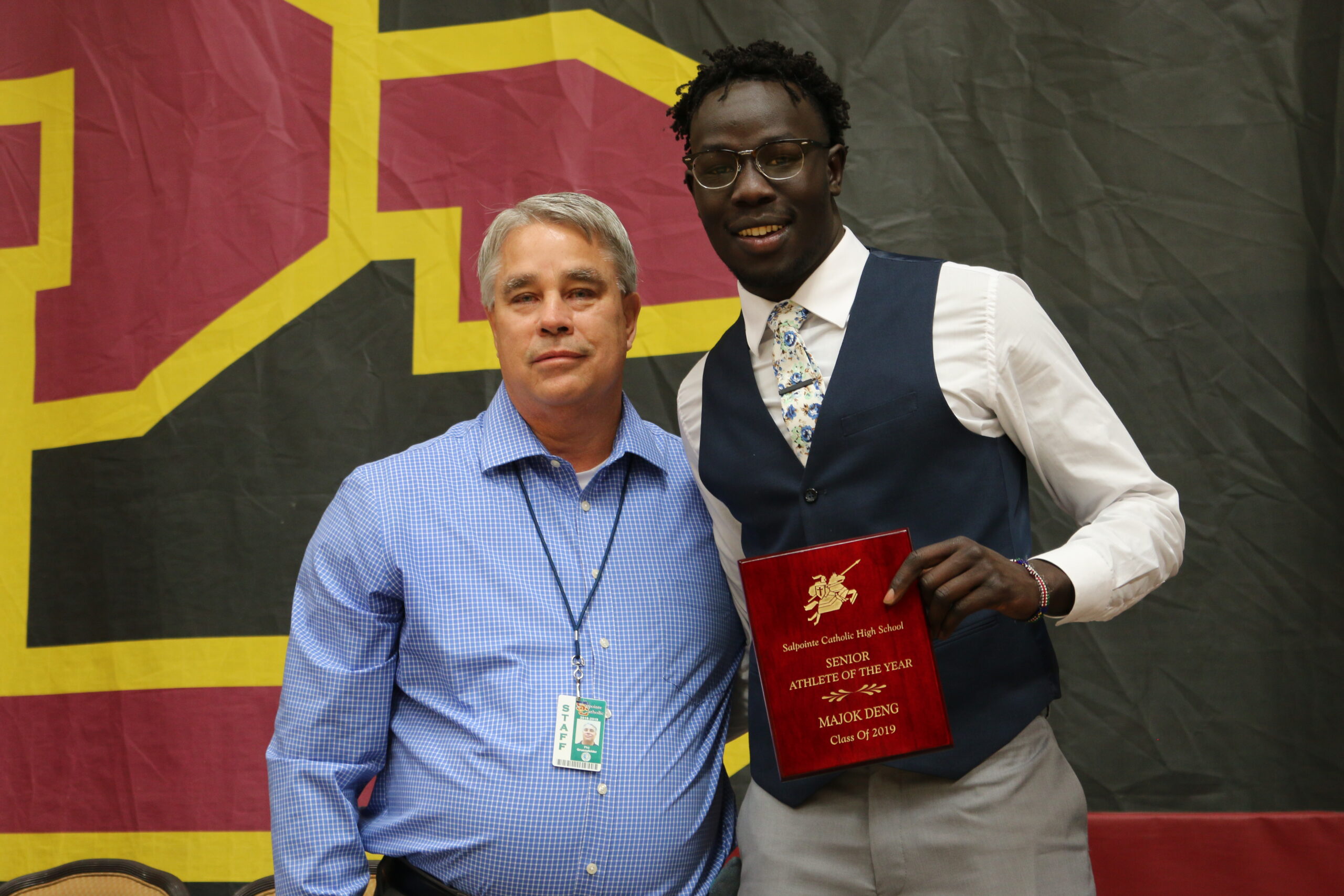 Senior athlete of the year posing with staff member