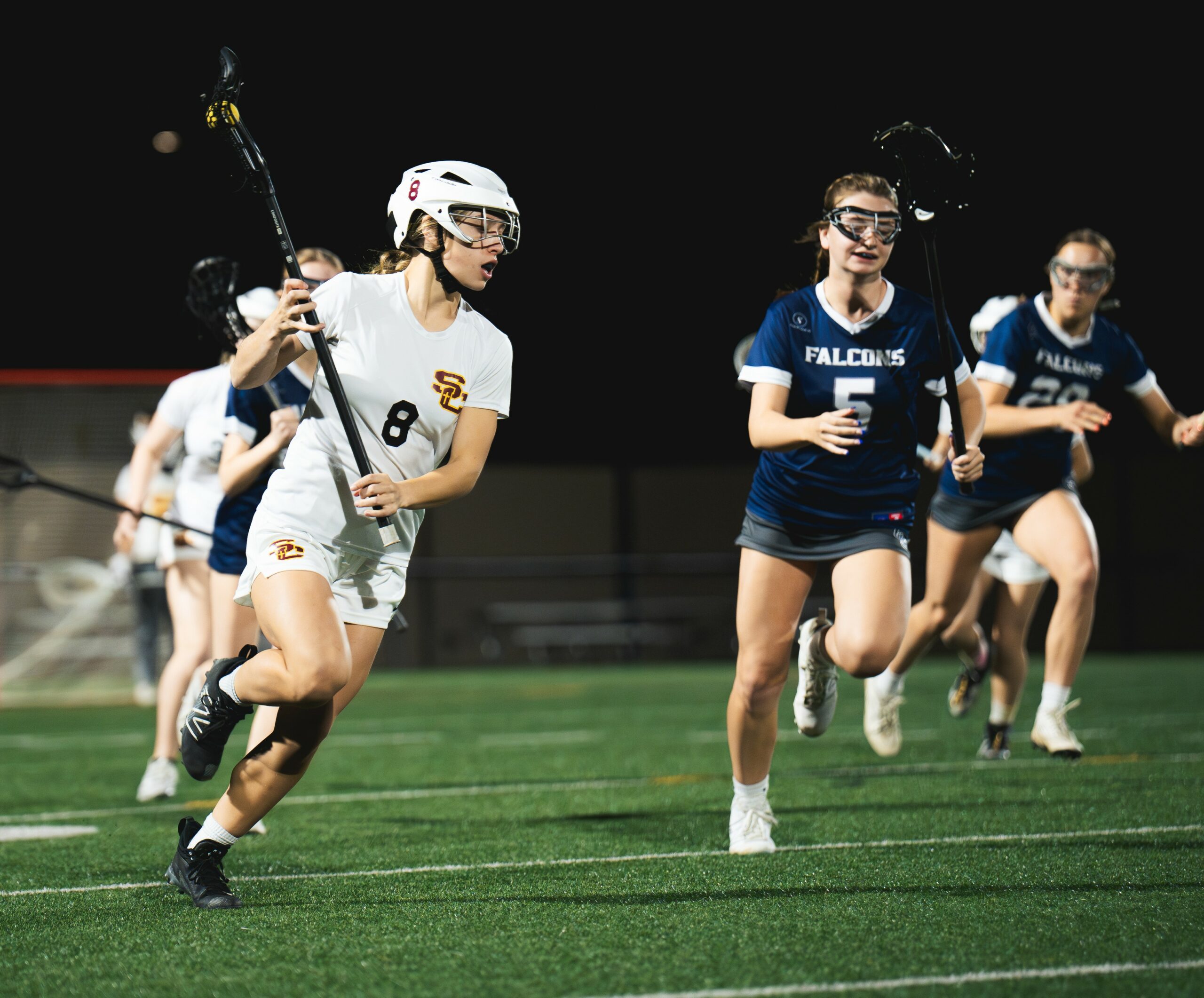 Girls playing lacrosse